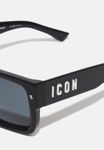 Black sunglasses with a rectangular frame, gray lenses, and bold white "ICON" text on the side. Smooth plastic texture and minimal hardware.