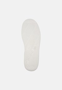 White rubber shoe sole with textured wave pattern, featuring the "Camper" logo and size marking "42" on the side. Flat, rounded shape.