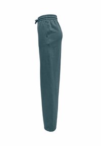 Temne teal trenirke s taperiranim krojem, elastičnim pasom, nastavljivo vrvico in stranskimi žepi. Mehka tkanina z gladko teksturo.