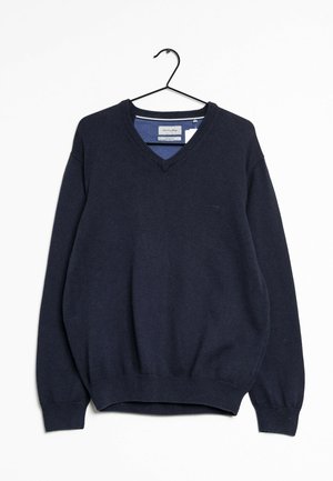 Marineblauwe V-hals pullover trui hangt aan een zwarte hanger tegen een witte achtergrond, met geribbelde boorden en tailleband.