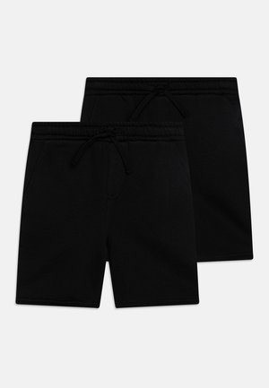 Pantaloni corti neri in cotone con vita elasticizzata, coulisse e tasche laterali. Presentano una texture liscia e un design semplice.