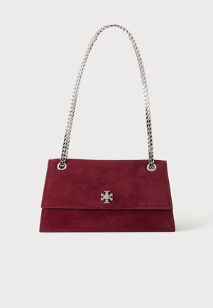 Maroon suede handbag with silver chain strap and silver logo emblem on front flap, displayed on plain light background.