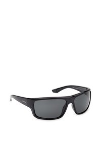 Lunettes de soleil rectangulaires à monture noire avec verres foncés, branches légèrement courbées et un subtil logo Timberland sur le côté.