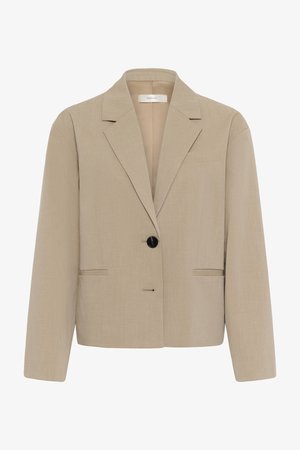 Beež lühendatud bleiser sisselõigetega krae, ühe musta nupuga sulgumine, pikad varrukad ja ees asetsevad sisetaskud.