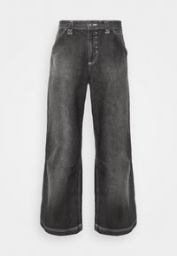 Vita jeans i mörkgrå denim med synlig sömnad, fem-knappsstängning och sidfickor. Tyget har en slät yta med en lätt blekning.