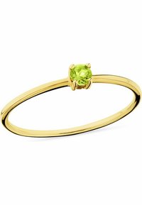 Guldring med en delikat bård och en rund, ljusgrön ädelsten inställd i en sexklorad fästning. Slät yta med en polerad glans.