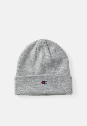 Gray knit beanie with a folded cuff. Features a small embroidered logo in red and blue. Soft texture, rounded top, lightweight design.