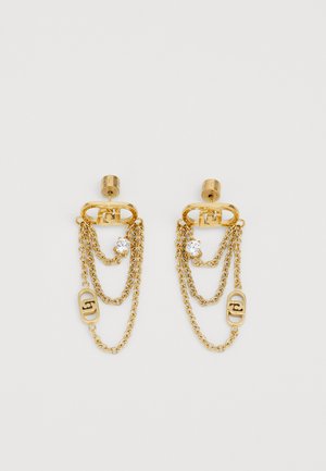 Gold-tone earrings with layered chain design, featuring a crystal accent and branded hardware. Three chains hang from a circular stud.