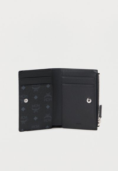 Black leather wallet with multiple card slots, textured interior featuring MCM logo pattern, and a silver snap closure.