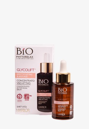 Bouteille compte-gouttes en verre brun avec un capuchon pipette blanc, étiquetée "Glycolift", dans une boîte blanche avec des accents roses et un logo. Taille de 30 ml.