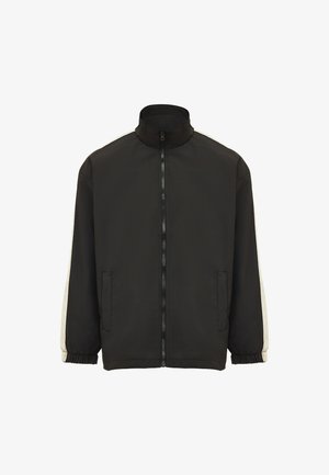 Black jacket with high collar, full zip front, and elastic cuffs. Features cream-colored stripes along sleeves and front pockets.