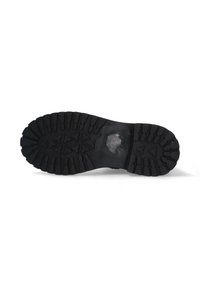 Semelle en caoutchouc noir avec un motif de crampons texturé composé de formes triangulaires et rectangulaires pour une meilleure adhérence. Légères traces d'usure visibles près du centre.