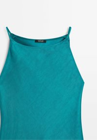 Turquoise sleeveless top with thin straps and a high neckline, showing a black label reading Massimo Dutti made in Morocco.
