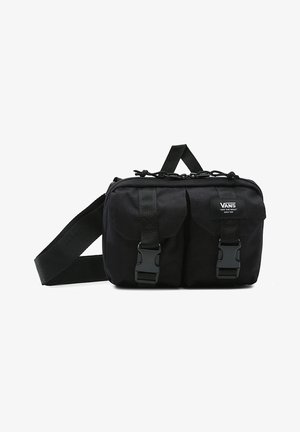 Petit sac bandoulière noir Vans avec deux poches avant sécurisées par des boucles en plastique et une sangle réglable.