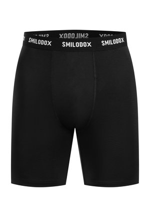 Černé boxerky vyrobené z elastického materiálu s hladkou texturou. Mají bílý elastický pásek se značkovým potiskem a těsný střih.