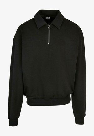 Svart hettegenser laget av bomullsblanding. Har en glidelås ved kragen, lange ermer, ribbestrikkede mansjetter og en avslappet passform.