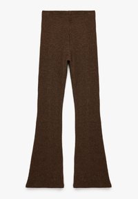 Bruna ribbade byxor med utsvängd nederdel, utan sömmar i midjan och mjuk textur, med en åtsittande silhuett och bred öppning i benen.