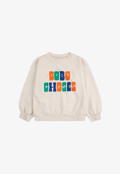 Sweatshirt couleur crème avec de longues manches bouffantes. Présente un texte audacieux et multicolore "BOBO CHOSES" en vert, orange, bleu et rouge.