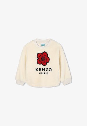Sweter z kremowego polaru z czerwonym wzorem kwiatu i czarnym napisem "KENZO PARIS". Żebrowane mankiety i dekolt. Miękka faktura.