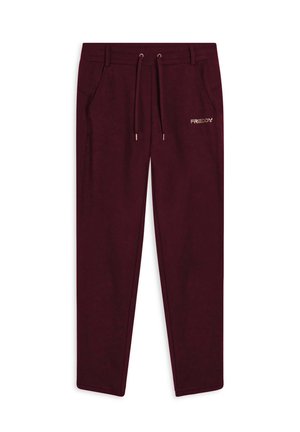Pantaloni della tuta bordeaux con elastico in vita, cordoncino regolabile, tasche laterali e un piccolo logo dorato "FREDDY" sulla coscia sinistra.