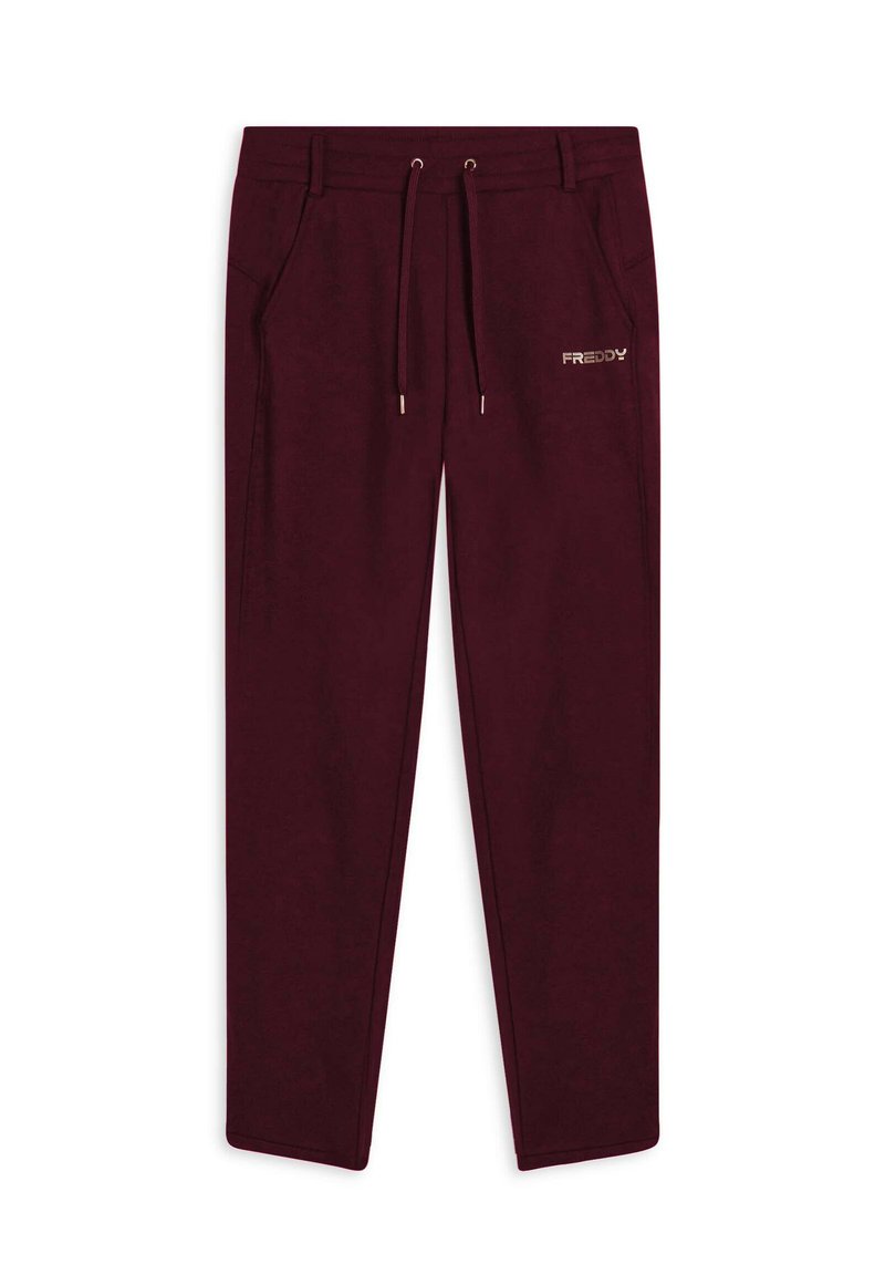 Pantalons de survêtement bordeaux avec une taille élastique, un cordon de serrage ajustable, des poches latérales et un petit logo doré "FREDDY" sur la cuisse gauche.