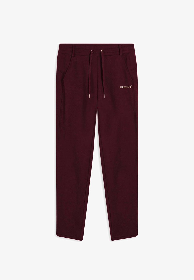 Pantalons de survêtement bordeaux avec une taille élastique, un cordon de serrage ajustable, des poches latérales et un petit logo doré "FREDDY" sur la cuisse gauche.