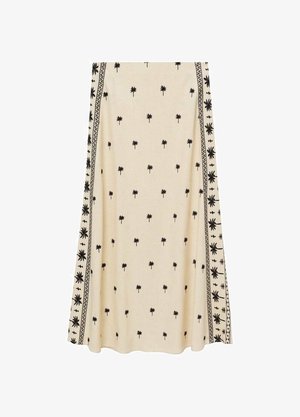 Cream-colored skirt with small black palm tree print, featuring intricate black border patterns along the sides, made from lightweight fabric.