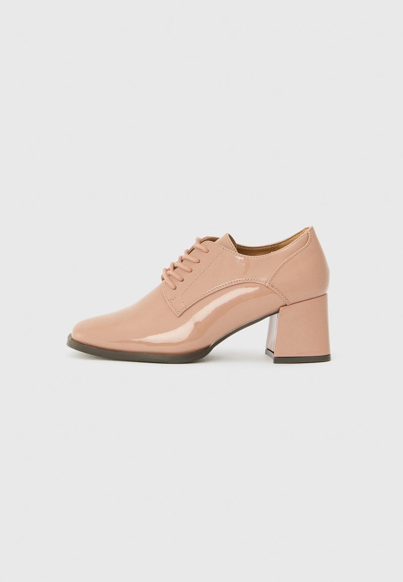 Pink patent leather lace-up shoe with a square heel, featuring a smooth texture and clean lines. Heel height is moderate.