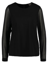 Blusa nera a maniche lunghe con tessuto trasparente sulle maniche, scollatura rotonda e chiusura con zip sul retro.