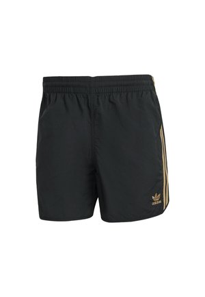 Black athletic shorts made of lightweight material, featuring a textured surface, elastic waistband, and gold side stripes with a logo.