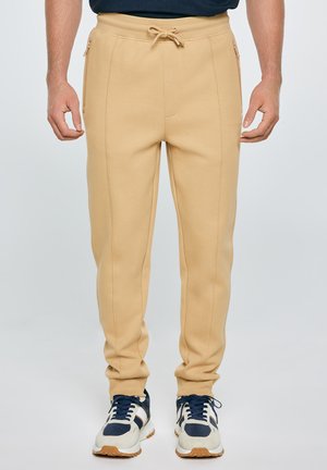 - Spodnie treningowe