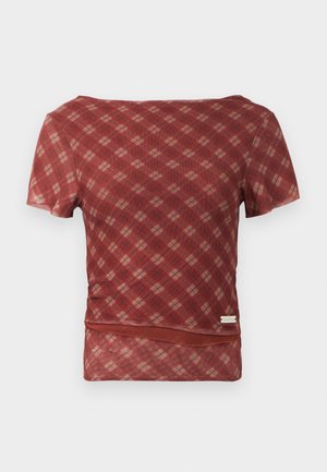 Red and beige plaid short-sleeve top with a smooth texture and a fitted waist, featuring a hemline with a subtle gathering detail.