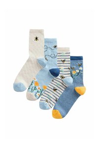 Set van vier sokken: lichtbeige met honingraatpatroon, lichtblauw met bloemmotief, blauw met strepen en bijen, marineblauw met gele hiel.