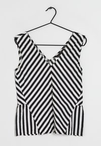 Zwart-wit gestreepte mouwloze top met een diepe V-hals en zijplooien, gemaakt van een lichtgewicht stof en met een casual pasvorm.