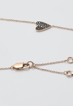 Rose gold chain bracelet with a heart-shaped charm encrusted with small black stones and a lobster clasp closure.