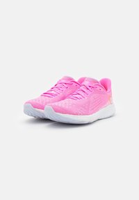 Pink athletic shoes with a breathable mesh upper, lace-up design, and white rubber sole featuring textured traction.