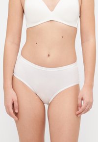 White cotton high-waisted panties with a smooth texture and elastic waistband, featuring a simple design and no visible patterns or accents.