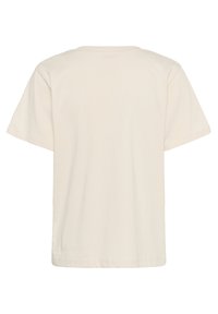 T-shirt à manches courtes, col ras du cou, en beige clair, fabriqué en coton. Design simple et sans ornement avec un ourlet droit et une coupe décontractée.