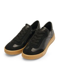 Black sneakers featuring a combination of textured leather and suede, a lace-up design, and a gum rubber sole with a low profile.