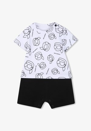 Salopetă cu mâneci scurte, albă, cu imprimeu negru cu față de desen animat, prevăzută cu capse la baza și pantaloni scurți contrastanți negri. Material din bumbac.