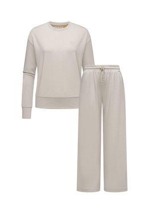Lys beige sweatshirt med lange ærmer og rund halsudskæring, parret med matchende brede bukser med elastisk talje og snor. 