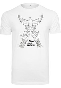 White cotton t-shirt featuring a black line drawing of a dove and hands, with the text "Peace & Freedom" underneath in a decorative font.