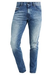 Faded blue denim jeans with a slim fit, featuring whiskered details, a slight distress on the knee, and five-pocket styling.