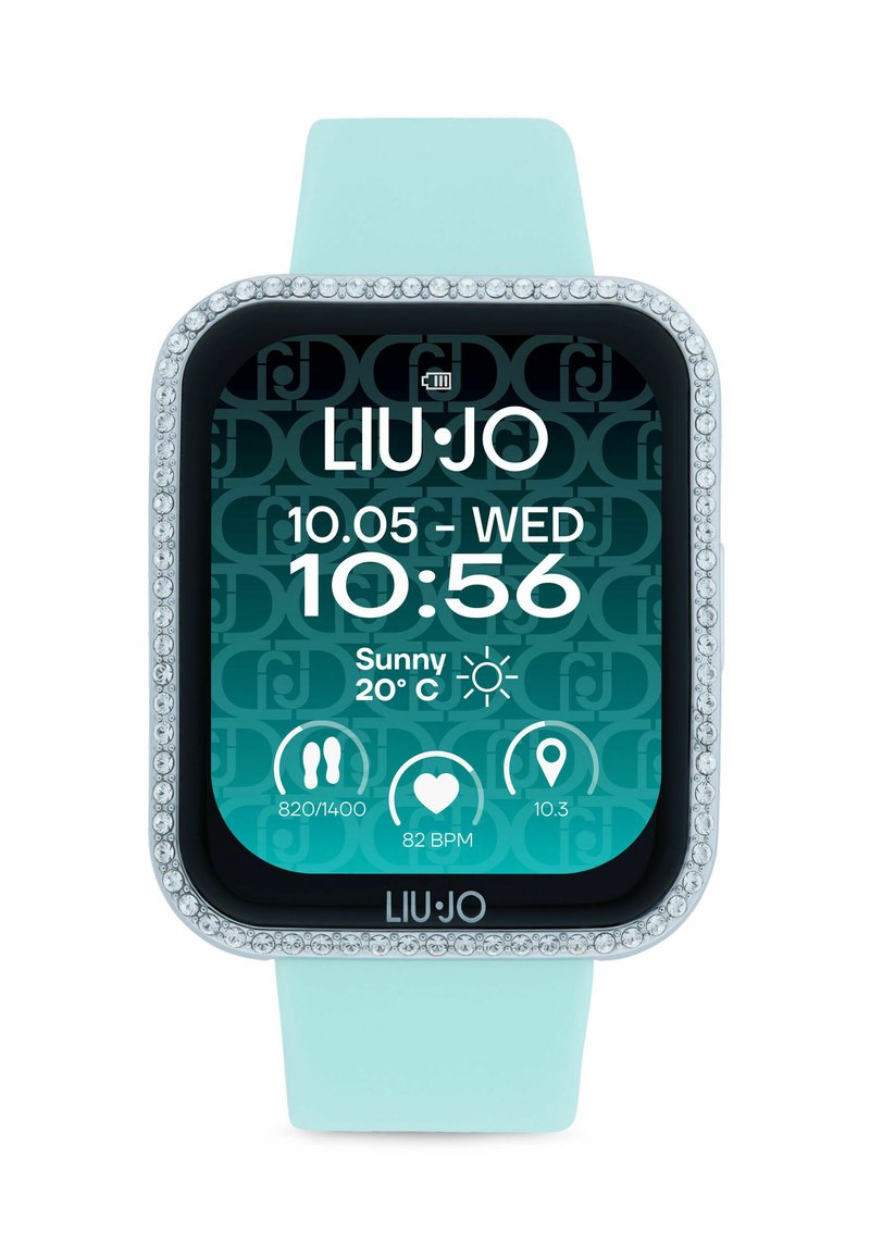 Inteligentné hodinky s obdĺžnikovým ciferníkom, jasnými krištáľovými akcentmi, tyrkysovým silikónovým remienkom a digitálnym displejom, ktorý zobrazuje čas, dátum a počasie.