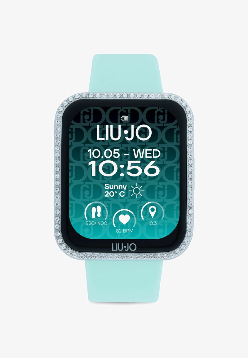 Inteligentné hodinky s obdĺžnikovým ciferníkom, jasnými krištáľovými akcentmi, tyrkysovým silikónovým remienkom a digitálnym displejom, ktorý zobrazuje čas, dátum a počasie.