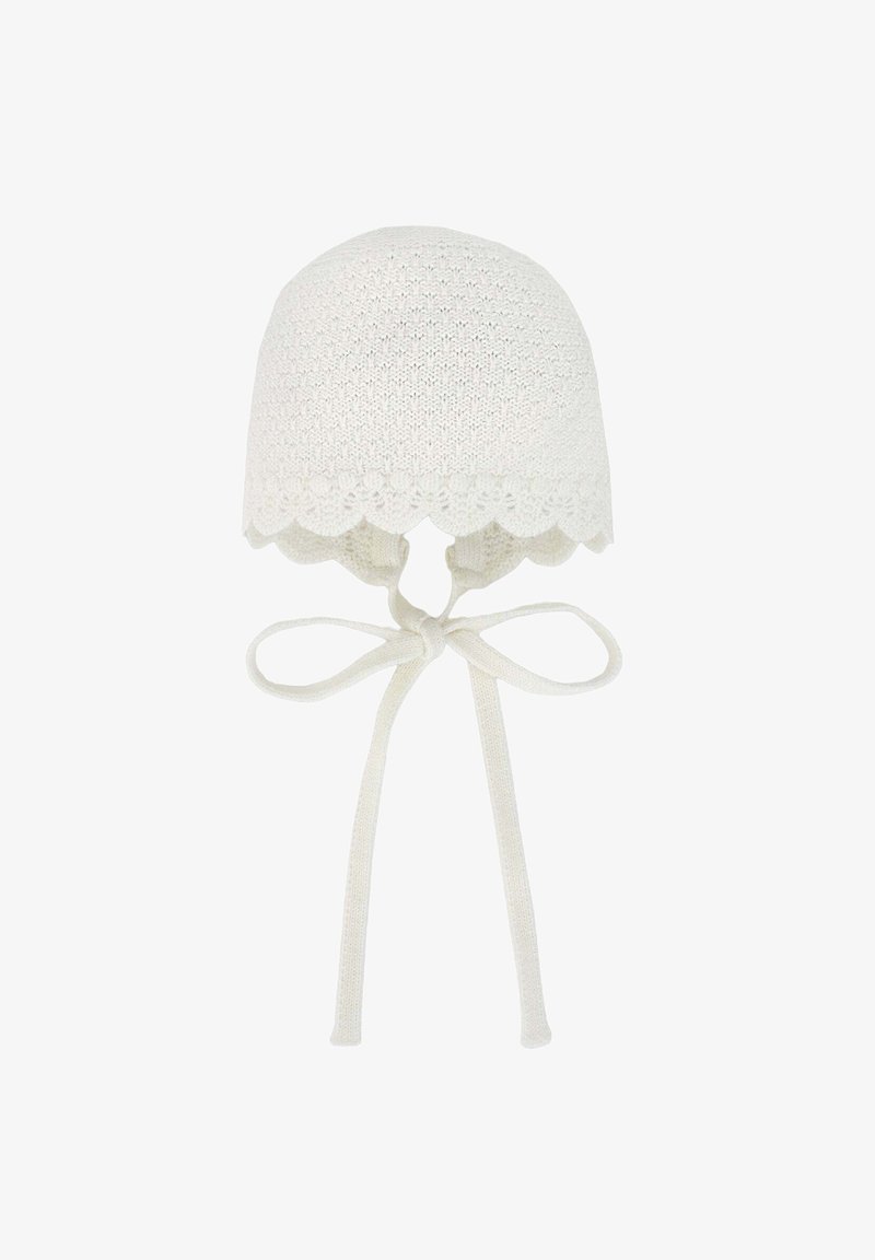 White knitted baby bonnet with a scalloped edge, ties below the chin for secure fit, featuring a textured pattern throughout.