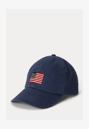 Navy blue cotton baseball cap with an embroidered American flag patch on the front, featuring a curved visor and stitched detail on the brim.