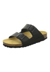 Black slip-on sandals featuring two adjustable straps, textured cork footbed, and a rubber sole with a ridged pattern for grip.