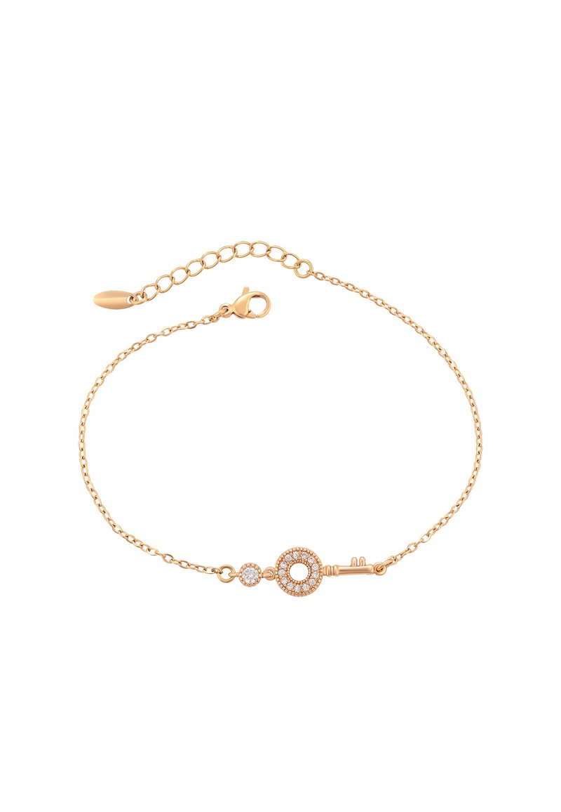 Bracciale in catena dorata con un charm a forma di chiave, accentato da un elemento circolare e un dettaglio in cristallo, che mette in mostra un design delicato e una texture raffinata.