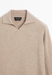 Beige long-sleeve cashmere sweater with open collar from Massimo Dutti, showing fabric texture and brand label.